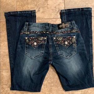 Miss Me mid-rise boot cut jeans.